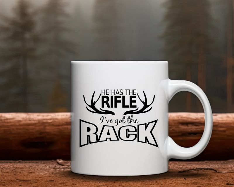 He Has The Rifle... I've Got The Rack Hunting Coffee Mug